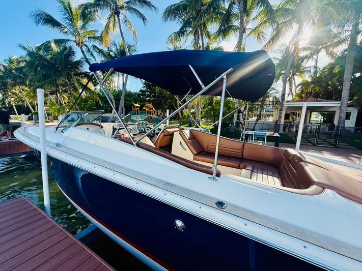 Yacht Photos Pics 2015 Chris-Craft Launch 32 boat docked, featuring a sleek design and luxurious seating.
