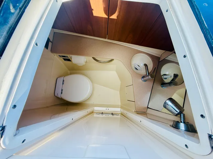  Yacht Photos Pics 2015 Chris-Craft Launch 32 boat interior with compact bathroom amenities.