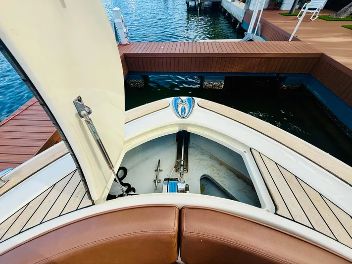  Yacht Photos Pics 2015 Chris-Craft Launch 32 bow storage area with open hatch, dockside view.