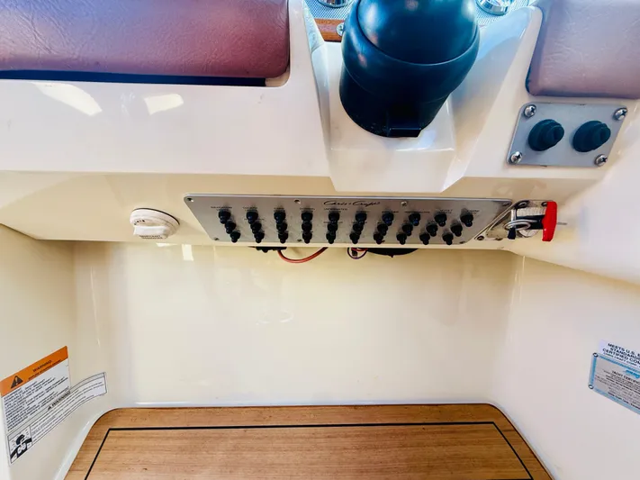  Yacht Photos Pics Control panel of a 2015 Chris-Craft Launch 32 boat with switches and labels.