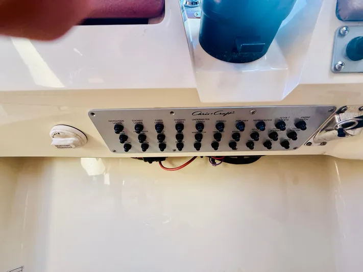  Yacht Photos Pics Control panel of a 2015 Chris-Craft Launch 32 boat with various switches.