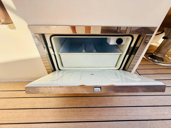  Yacht Photos Pics 2015 Chris-Craft Launch 32 boat cooler compartment on teak deck.