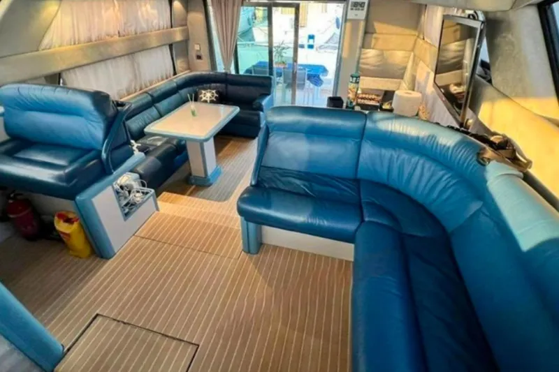  Yacht Photos Pics Luxurious interior of 1991 Dalla Pieta 52 Asterion yacht with blue leather seating.