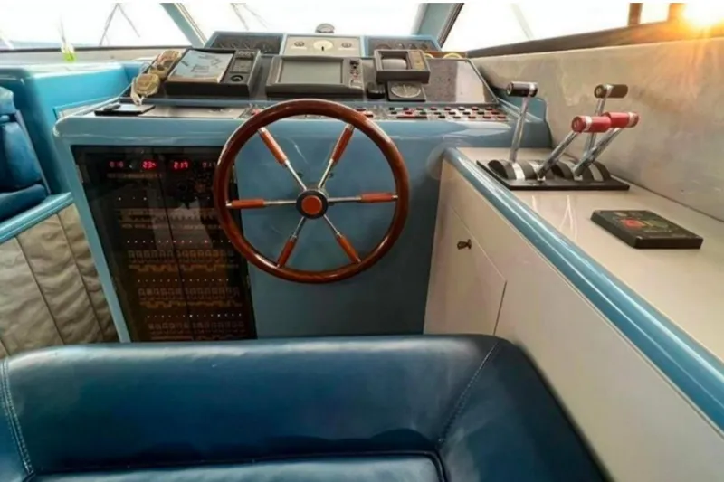  Yacht Photos Pics Cockpit of 1991 Dalla Pieta 52 Asterion yacht with wooden steering wheel and control panel.