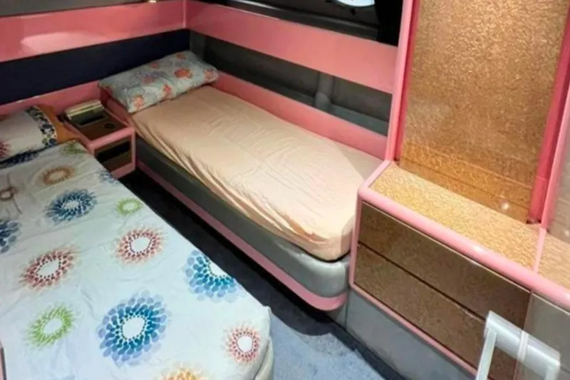 Yacht Photos Pics Interior of 1991 Dalla Pieta 52 Asterion yacht with twin beds and colorful decor.