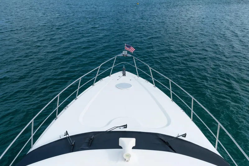 Mimosa Yacht Photos Pics Bow view of 2001 Cruisers Yachts 5000 Sedan Sport on open water.