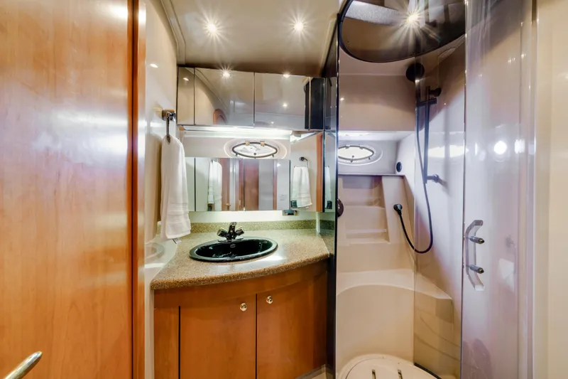 Mimosa Yacht Photos Pics Luxurious bathroom in 2001 Cruisers Yachts 5000 Sedan Sport with modern fixtures and elegant design.
