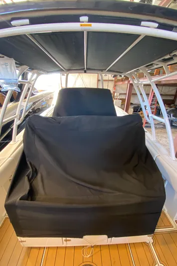 Apres Sea Yacht Photos Pics 2016 Chris-Craft Catalina 34 boat with covered seating, docked indoors.