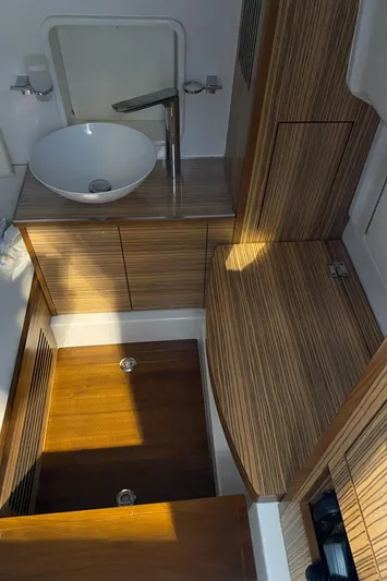Apres Sea Yacht Photos Pics 2016 Chris-Craft Catalina 34 interior with modern wood finish and sleek sink design.