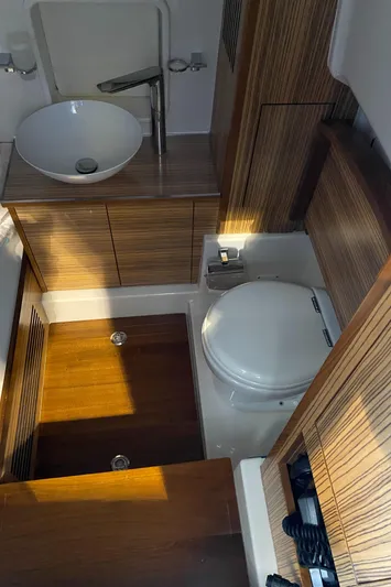 Apres Sea Yacht Photos Pics 2016 Chris-Craft Catalina 34 bathroom with modern sink and wooden cabinetry.