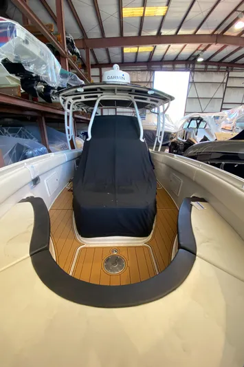 Apres Sea Yacht Photos Pics 2016 Chris-Craft Catalina 34 boat in storage, featuring teak deck and covered seating.