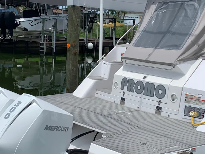  Yacht Photos Pics 2022 Evolve 360HT boat with Mercury engines docked at marina.