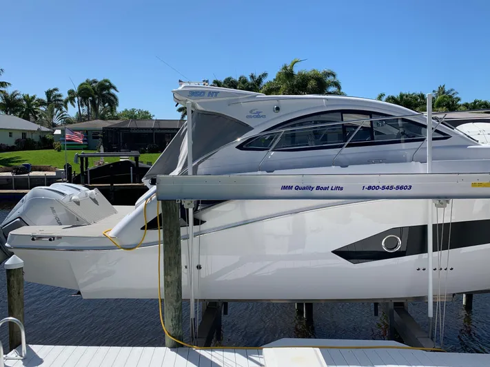  Yacht Photos Pics 2022 Evolve 360HT boat docked, showcasing sleek design and modern features.