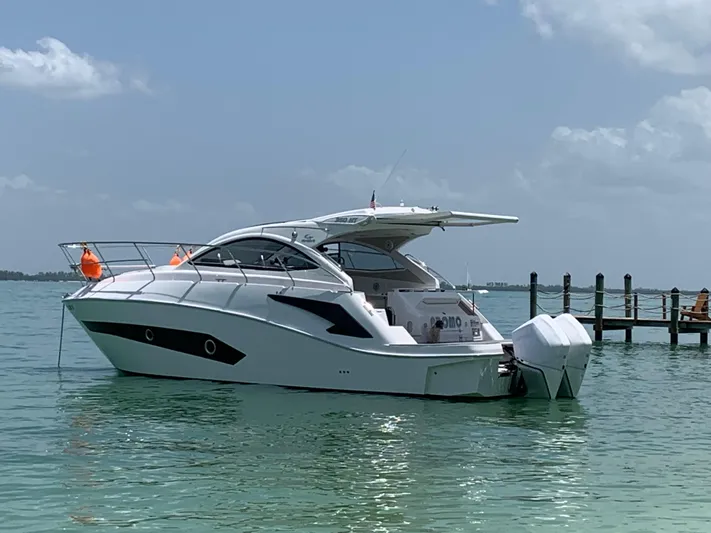  Yacht Photos Pics 2022 Evolve 360HT yacht on calm water, clear sky background.