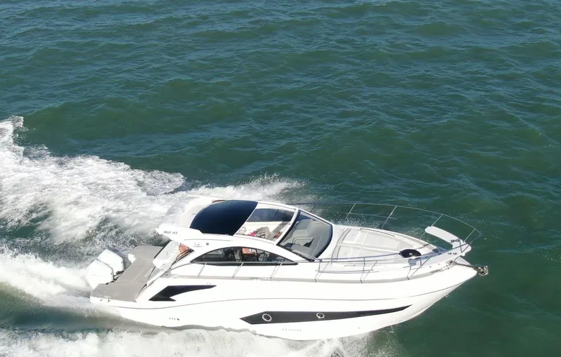  Yacht Photos Pics 2022 Evolve 360HT yacht cruising on open water, showcasing sleek design and performance.