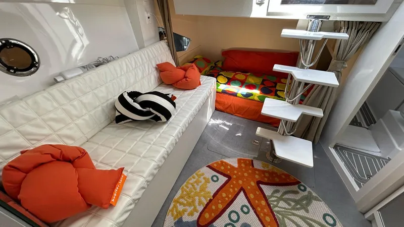  Yacht Photos Pics Interior of 2022 Evolve 360HT yacht with modern seating and colorful decor.
