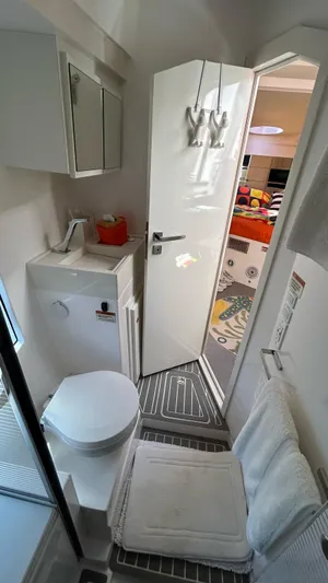  Yacht Photos Pics Compact bathroom in 2022 Evolve 360HT RV with modern amenities and sleek design.