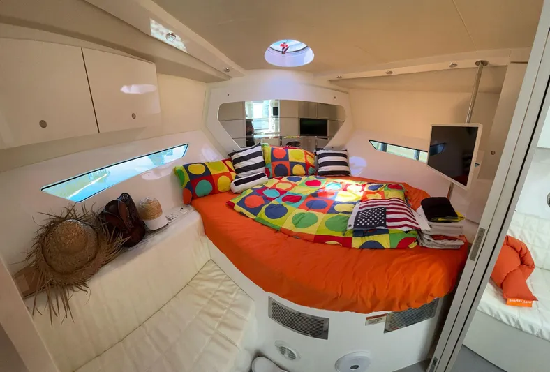  Yacht Photos Pics Cozy cabin interior of 2022 Evolve 360HT with colorful bedding and modern amenities.