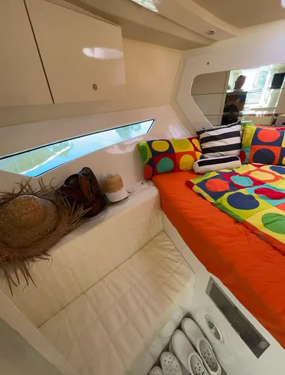  Yacht Photos Pics Interior of 2022 Evolve 360HT yacht with colorful bedding and modern design.