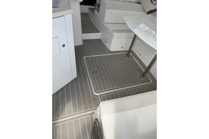  Yacht Photos Pics Interior of 2022 Evolve 360HT boat with sleek seating and modern flooring.