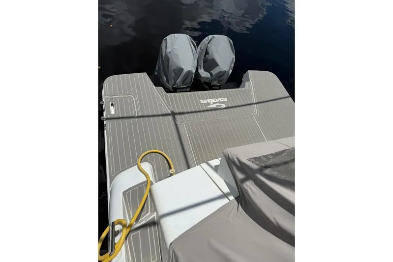  Yacht Photos Pics Evolve 360HT 2022 boat deck with covered engines and mooring line.