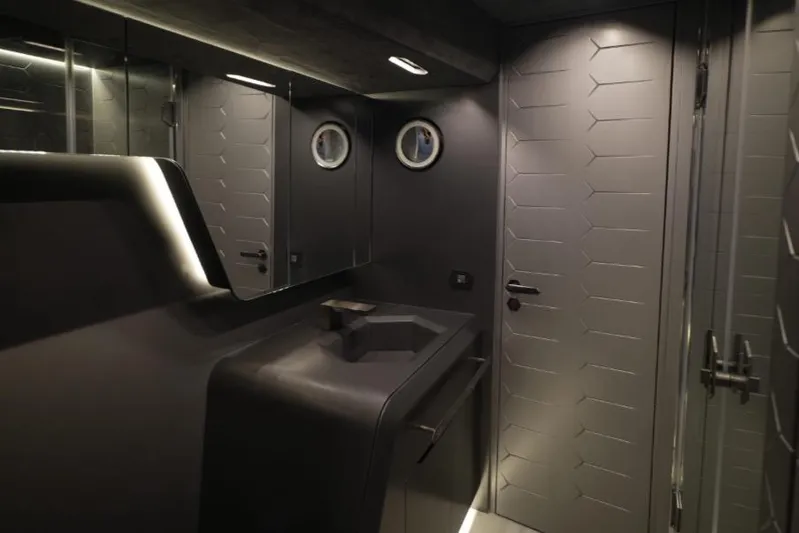  Yacht Photos Pics Luxurious interior of 2023 Tecnomar Lamborghini 63 yacht bathroom with sleek, modern design.