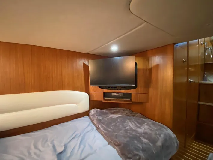 Kostas More Yacht Photos Pics Interior of 2009 Tiara Yachts 4300 Sovran with TV and bed.