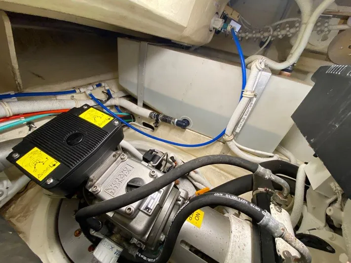 Kostas More Yacht Photos Pics Engine room of 2009 Tiara Yachts 4300 Sovran with cables and hoses.