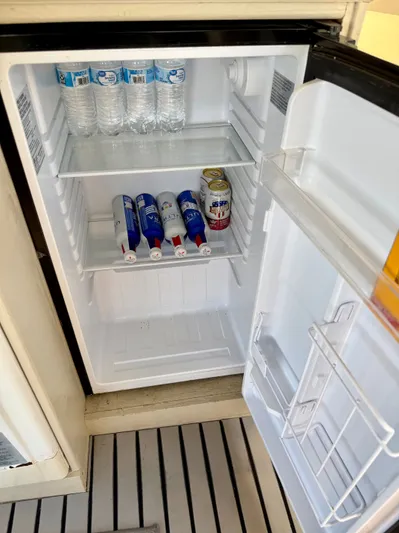 Journey's End Yacht Photos Pics Fridge with water bottles and drink cans, Californian 48MY 1989.