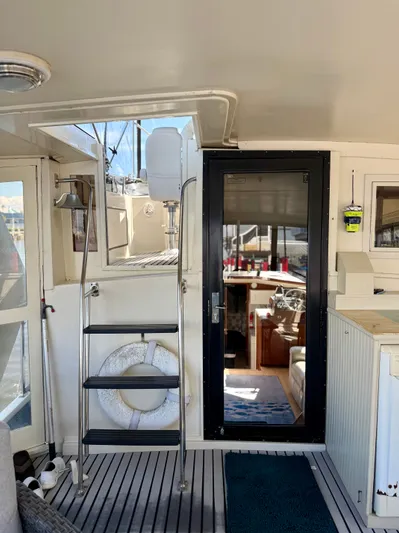 Journey's End Yacht Photos Pics Interior of a 1989 Californian 48MY yacht with stairs and helm area.