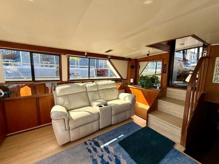 Journey's End Yacht Photos Pics Interior of a 1989 Californian 48MY yacht with leather sofa and wood accents.