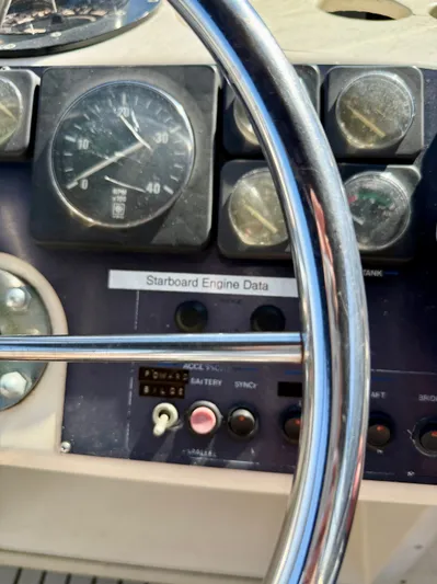 Journey's End Yacht Photos Pics Steering wheel and dashboard of a 1989 Californian 48MY boat.