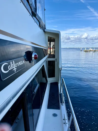 Journey's End Yacht Photos Pics 1989 Californian 48MY yacht on water with blue sky.