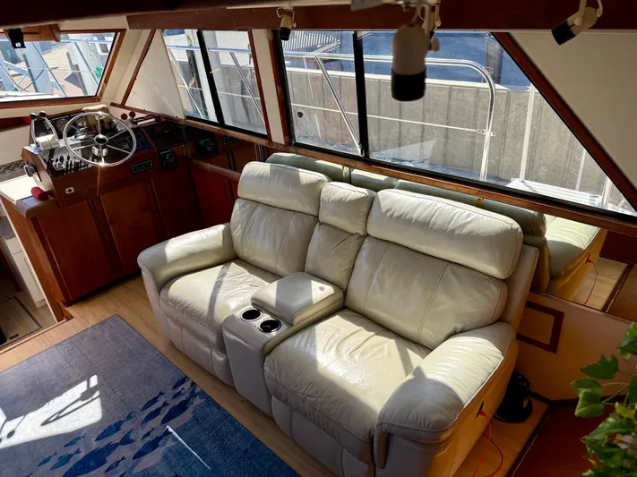 Journey's End Yacht Photos Pics Interior of a 1989 Californian 48MY yacht with leather sofa and helm.