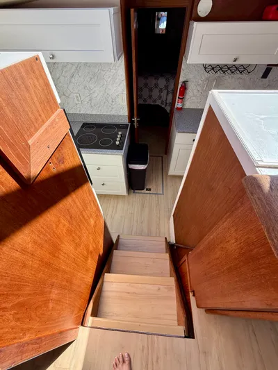 Journey's End Yacht Photos Pics Interior of a 1989 Californian 48MY yacht with stairs and kitchen.