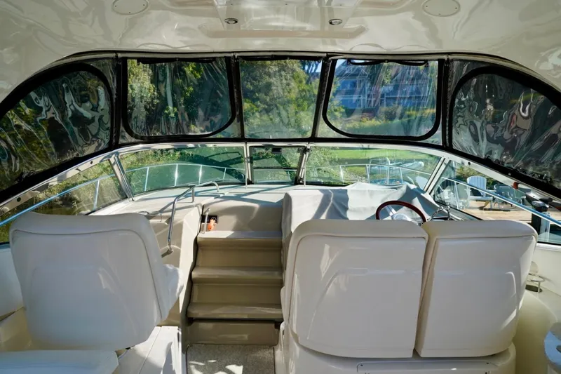  Yacht Photos Pics Interior view of 2010 Sea Ray 370 Sundancer yacht cockpit with seating and helm.