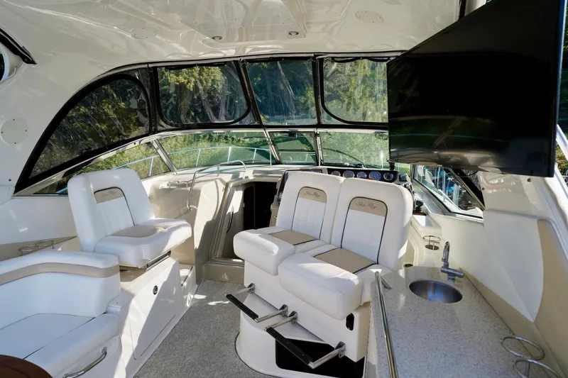  Yacht Photos Pics Interior of 2010 Sea Ray 370 Sundancer yacht with helm, seating, and TV.