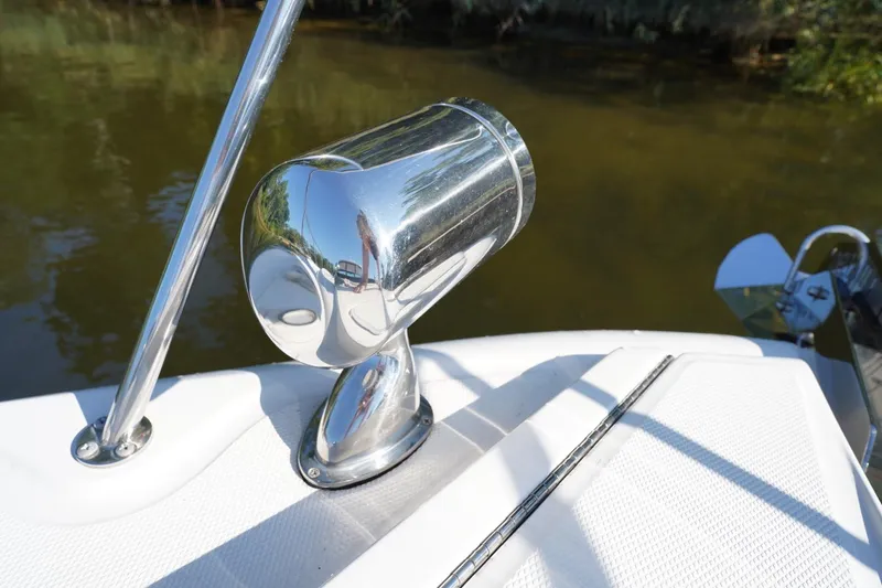  Yacht Photos Pics Chrome spotlight on 2010 Sea Ray 370 Sundancer boat deck by water.