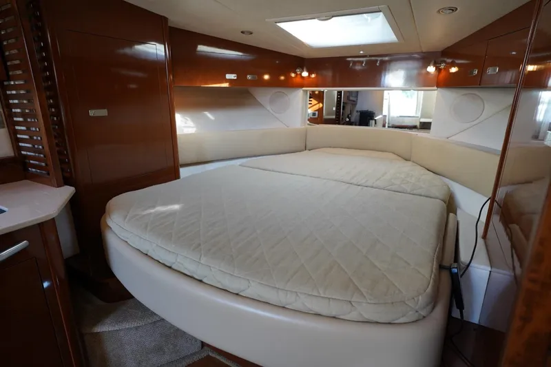  Yacht Photos Pics Luxurious interior cabin of 2010 Sea Ray 370 Sundancer yacht with cozy bed.