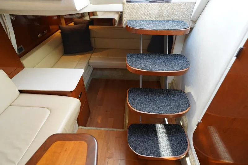  Yacht Photos Pics Interior of 2010 Sea Ray 370 Sundancer yacht with carpeted stairs and seating area.