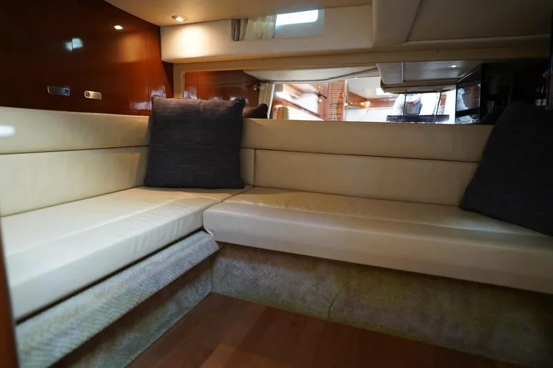  Yacht Photos Pics Luxurious interior of 2010 Sea Ray 370 Sundancer yacht with beige seating and cushions.