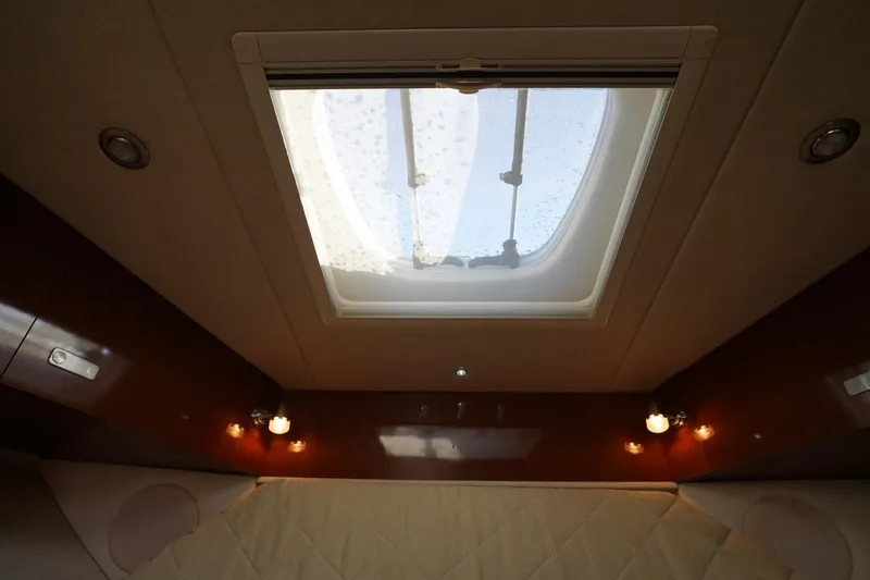  Yacht Photos Pics Interior view of 2010 Sea Ray 370 Sundancer cabin with skylight and ambient lighting.