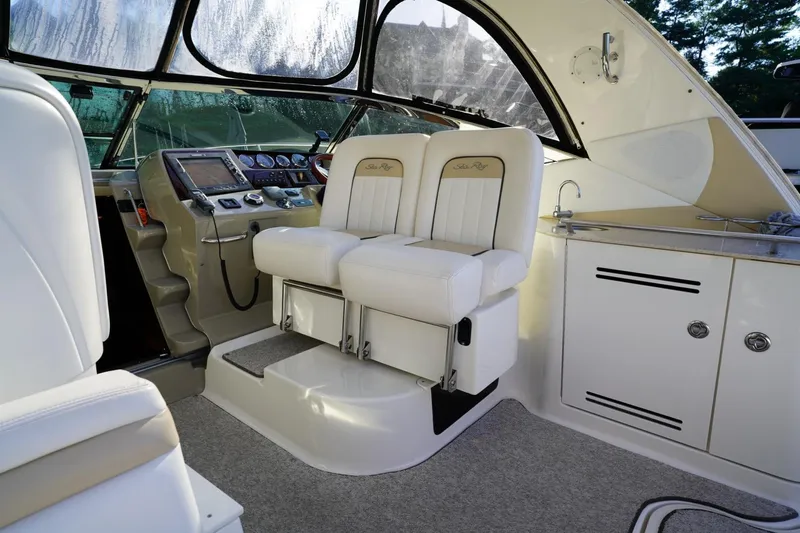  Yacht Photos Pics Interior of 2010 Sea Ray 370 Sundancer boat with helm and seating area.