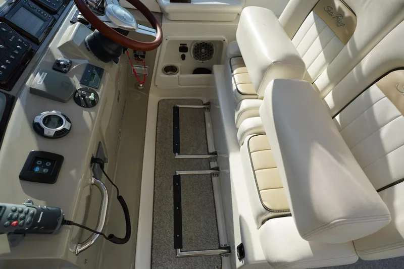  Yacht Photos Pics 2010 Sea Ray 370 Sundancer helm with leather seating and modern controls.