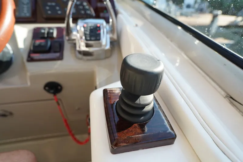  Yacht Photos Pics Control panel of a 2010 Sea Ray 370 Sundancer boat, featuring joystick and throttle.