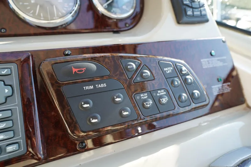  Yacht Photos Pics Control panel of a 2010 Sea Ray 370 Sundancer boat with various switches.