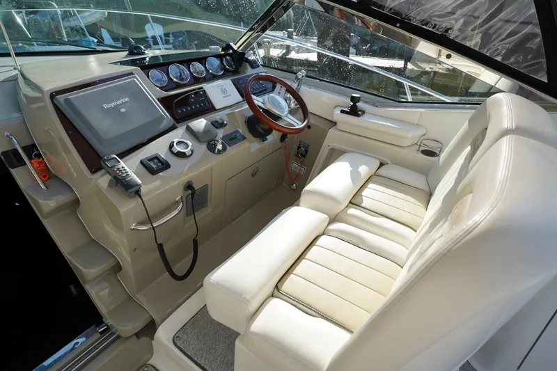  Yacht Photos Pics Cockpit of 2010 Sea Ray 370 Sundancer with steering wheel and navigation equipment.