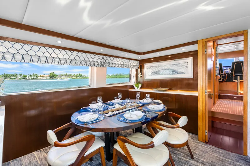 Azure Yacht Photos Pics Luxurious dining area on 1991 Maiora Planning yacht with elegant table setting and scenic view.