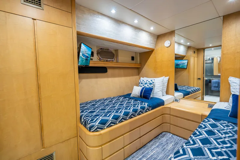 Azure Yacht Photos Pics Luxurious 1991 Maiora Planning yacht cabin with twin beds, elegant wood finish, and modern decor.