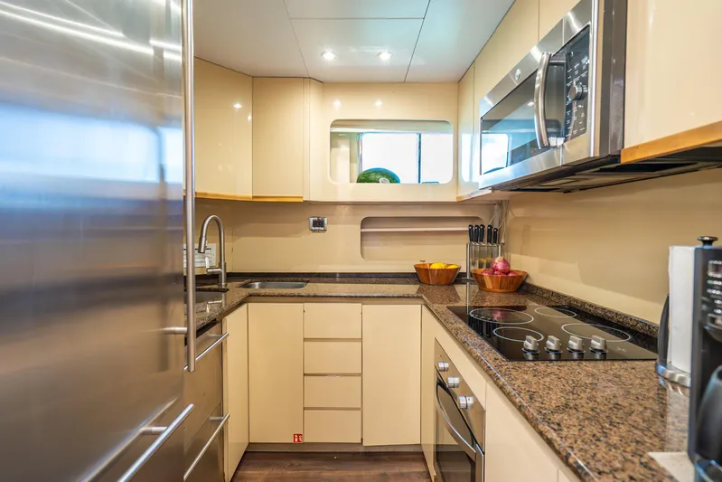 Azure Yacht Photos Pics Modern yacht kitchen with sleek appliances, granite countertops, and ample storage, Maiora Planning 1991.